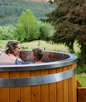 woman and boy in outdoor spa